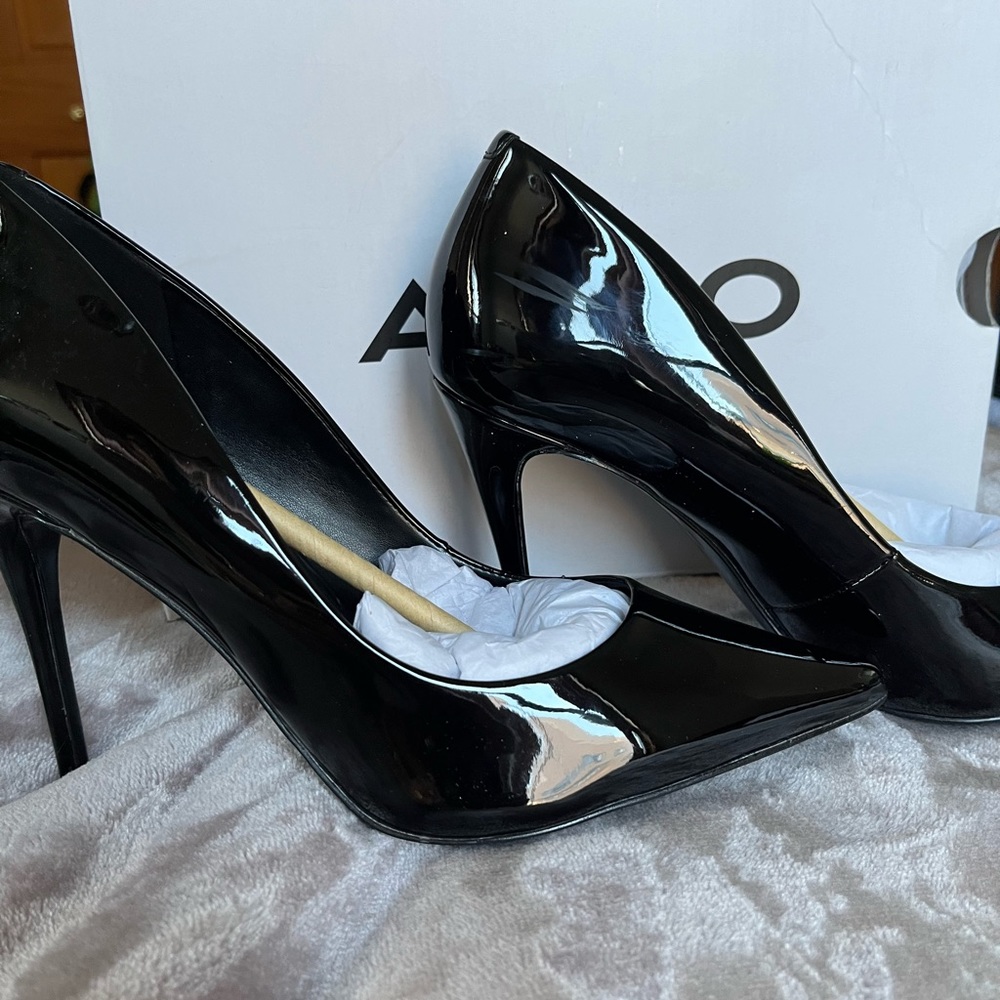 Size 8 black patent leather stilettos from Aldo. 4” heel.